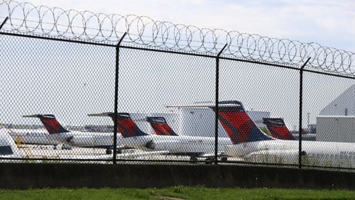 Delta jets are seen parked at Hartsfield-Jackson International Airport during the coronavirus slow down. Curtis Compton ccompton@ajc.com