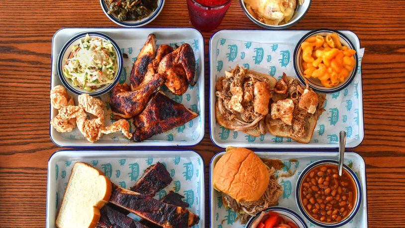 Rodney Scott's Whole Hog BBQ is now open in the Pittsburgh neighborhood near West End in Atlanta, with offerings that include (top row, from left) Collard Greens, Sweet Tea, Ella's Banana Puddin'; (middle row, from left) Pit Cooked 1/2 Bird (chicken) with pork skins and coleslaw, Rod's Original Whole Hog Pork Sandwich "The King of the Menu" with mac and cheese; (bottom row, from left) Pit Cooked Pork Spare Ribs, Pit Cooked Pulled Pork sandwich with tomato cucumber side (seasonal) and baked beans. (Chris Hunt for The Atlanta Journal-Constitution)