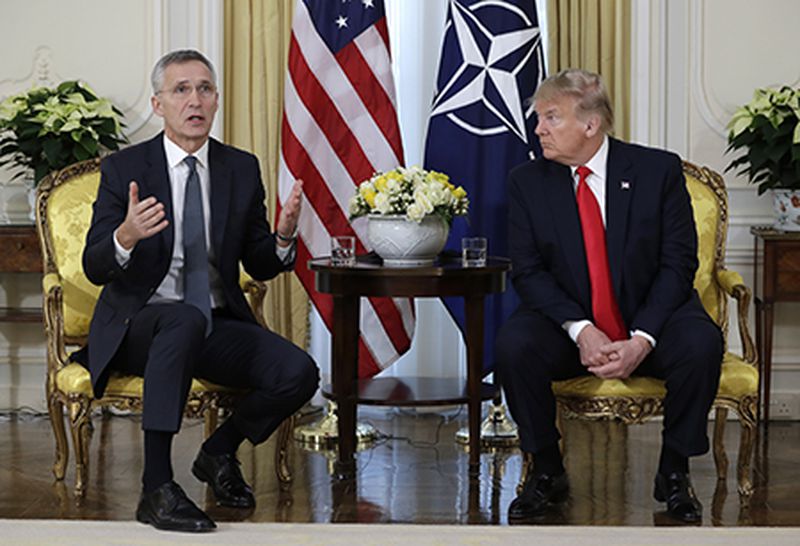 President Donald Trump meets NATO Secretary General Jens Stoltenberg on Tuesday at Winfield House in London.