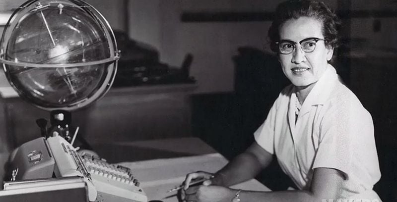 NASA research mathematician Katherine Johnson is photographed at her desk at NASA Langley Research Center with a globe, or "Celestial Training Device."