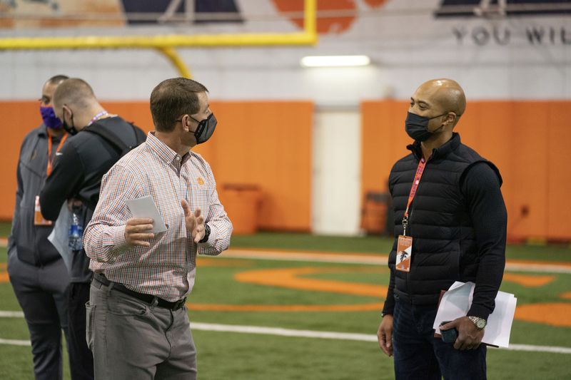 Falcons general manager Terry Fontenot talking with Clemson coach Dabo Swinney at quarterback Trevor Lawrence's Pro Day workout on Friday, February 12, 2021. (Photo credit:  Courtesy of David Platt/Clemson Athletics)