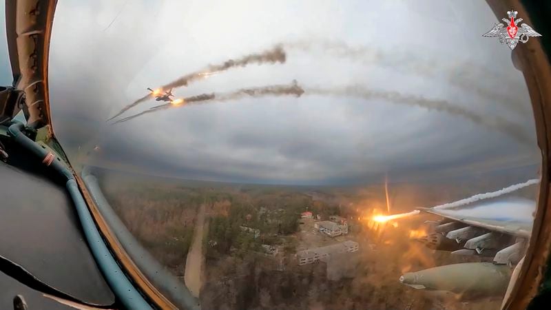 FILE - In this photo taken from video released by the Russian Defense Ministry Press Service on Monday, Jan. 22, 2024, a Su-25 warplane is seen from the cockpit of another such aircraft as they fire rockets on a mission over Ukraine. The Russian Defense Ministry said that the military will hold drills involving tactical nuclear weapons – the first time such exercise was publicly announced by Moscow. (Russian Defense Ministry Press Service via AP, File)