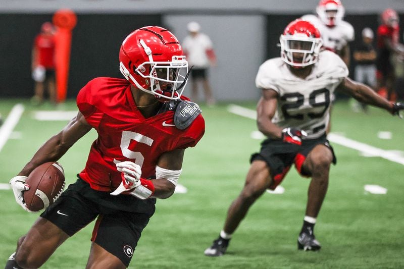 Georgia wide receiver Adonai 'A.D.' Mitchell (5) turns up field after hauling in a pass during the Bulldogs’ practice session in Athens on Monday, Aug. 16, 2021. (Photo by Mackenzie Miles/UGA Athletics)