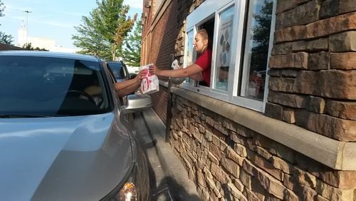 A Chick-fil-A restaurant near the Mall of Georgia in Gwinnett County. Take-out orders are keeping some restaurants alive, but they don't need as much staff as when their dine-in areas were full. MATT KEMPNER / AJC