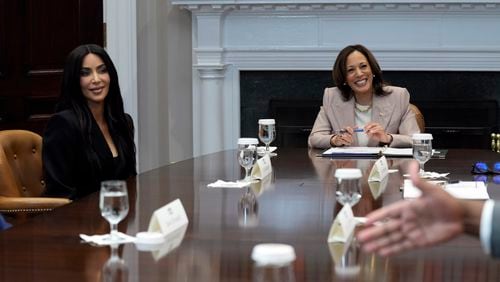 Vice President Kamala Harris, right, and Kim Kardashian, left, listen during a discussion in the Roosevelt Room of the White House in Washington, Thursday, April 25, 2024, on criminal justice reform and the pardons issued by President Joe Biden earlier this month. (AP Photo/Susan Walsh)