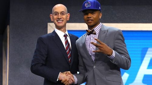Markelle Fultz walks on stage with NBA commissioner Adam Silver after being drafted first overall by the Philadelphia 76ers during the first round of the 2017 NBA Draft at Barclays Center on June 22, 2017 in New York City. (Photo by Mike Stobe/Getty Images)
