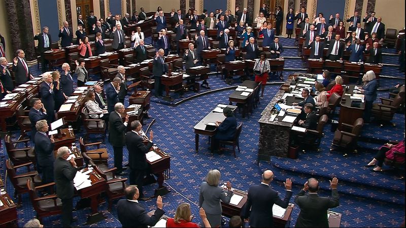 In this image from video from Senate Television, Sen. Patty Murray, D-Wash., swears senators in for the impeachment trial of Homeland Security Secretary Alejandro Mayorkas on the Senate floor at the U.S. Capitol, Wednesday, April 17, 2024, in Washington. (Senate Television via AP)