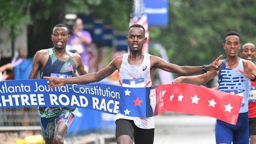 Charles Langat wins the 54th running of The Atlanta Journal-Constitution Peachtree Road Race in Atlanta on Tuesday, July 4, 2023.   (Hyosub Shin / Hyosub.Shin@ajc.com)