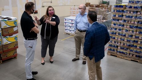 Cameron Turner, with the Atlanta Community Food Bank, gives a tour of their new Community Food Center in Stone Mountain on Thursday morning. Ben Gray for the Atlanta Journal-Constitution
