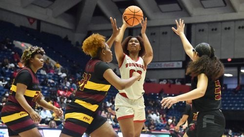 March 10, 2022 Macon - Woodward Academy's Sydney Bowles (0) shoots over Forest Park's Makayla Arnold (34) during the 2022 GHSA State Basketball Class AAAAA Girls Championship game at the Macon Centreplex in Macon on Thursday, March 10, 2022. (Hyosub Shin / Hyosub.Shin@ajc.com)