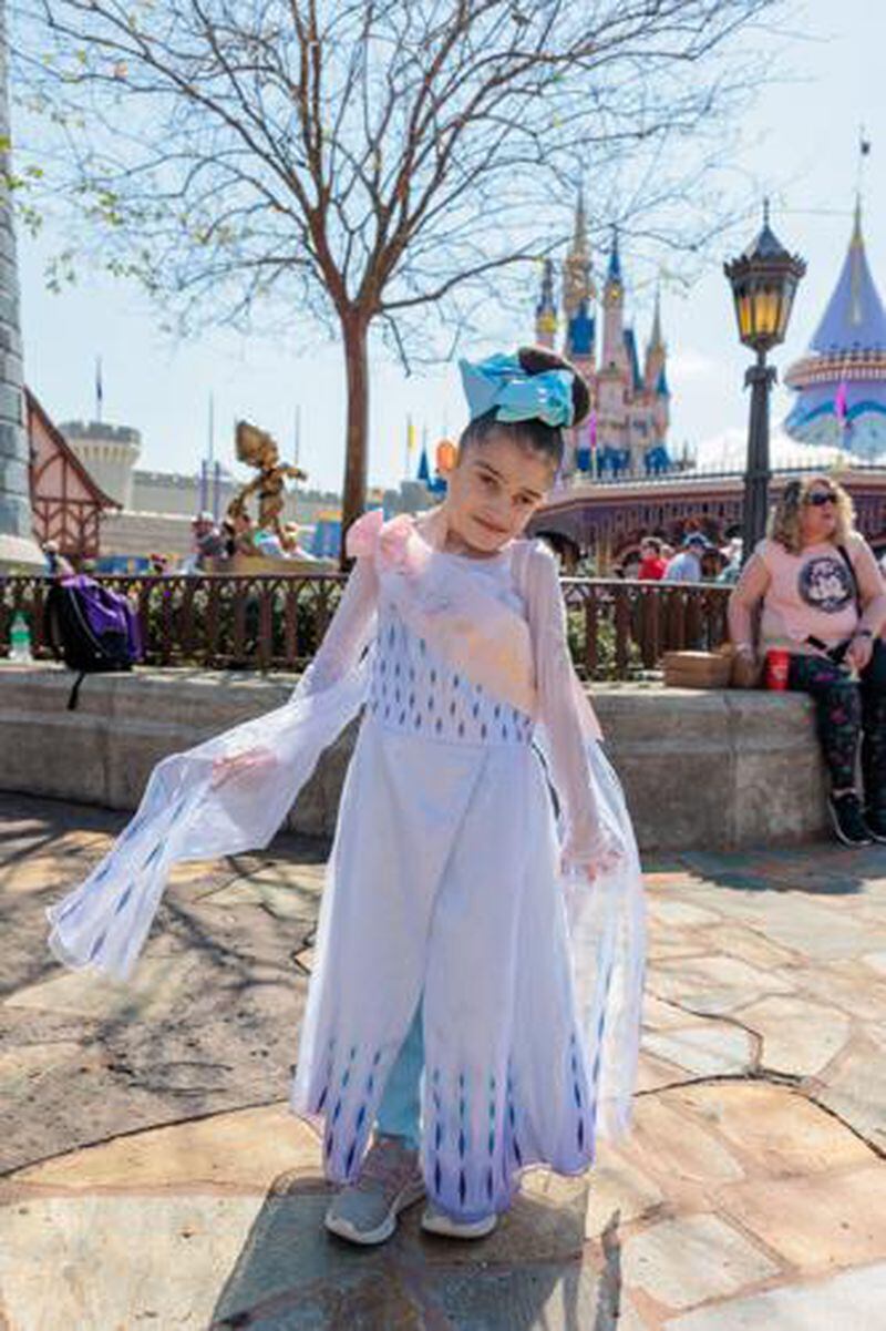 Seven-year-old Dakota of Acworth poses before Cinderella's Castle at Disney's Magic Kingdom. (Courtesy of Bert's Big Adventure)