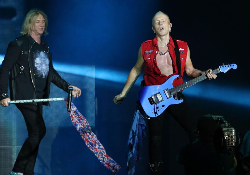 Def Leppard guitarist Phil Collen shows off his guitar skills and his admirable physique.  Photo: Robb Cohen Photography & Video/ www.RobbsPhotos.com