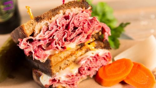 The Pastrami on Wry at Muss & Turner’s East Cobb is a decadent pile of slow-smoked wagyu beef brisket, melted Swiss, red onion and Dijon mustard on marble rye. CONTRIBUTED BY MICHAEL MUSSMAN PHOTOGRAPHY