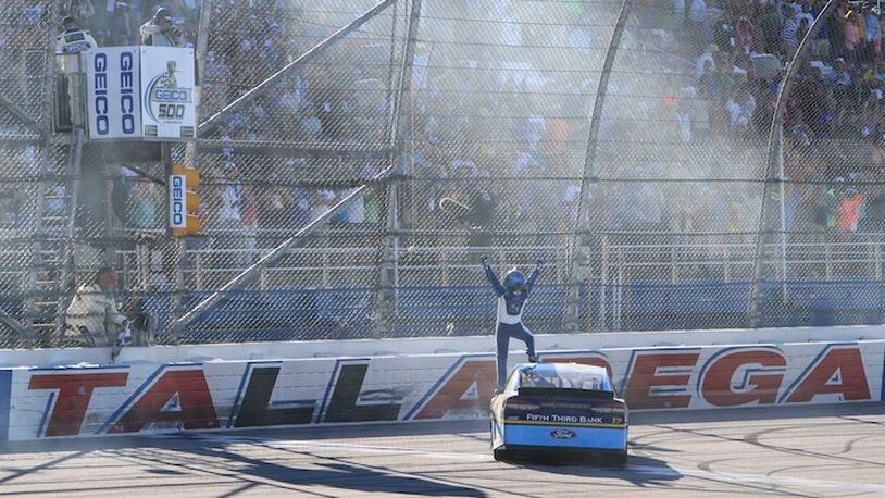 Ricky Stenhouse Jr. (17) celebrates at the start finish line after winning the Camping World 500 auto race at Talladega Superspeedway, Sunday, May 7, 2017, in Talladega, Ala. (AP Photo/Ron Sanders)