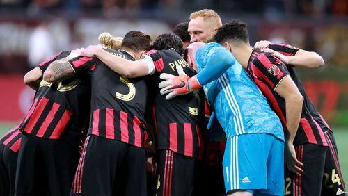 Atlanta United players huddle up as they prepare to play FC Cincinnati Sunday, March 10, 2019, at Mercedes-Benz Stadium in Atlanta.