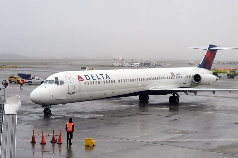 DECEMBER 27, 2015 ATLANTA The Delta MD-88 plan arrives from Gulfport MS with the 100 millionth passenger aboard. Hartsfield-Jackson International Airport awarded its 100 millionth passenger for 2015 with prizes including a new car, two free airline tickets and a small crowd of officials and television cameras early Sunday December 27, 2015. The Atlanta airport — the world’s busiest — is the first airport in the world to handle 100 million passengers in a year. “It’s our commitment that we maintain our position as the world’s most traveled airport,” said Atlanta Mayor Kasim Reed during remarks at the airport before the flight arrived Sunday morning. The winner, a man from Biloxi named Larry Kendrick who arrived at the airport in blue jeans, an orange t-shirt and a baseball cap, was surprised to learn upon landing that he had been selected as the 100 millionth passenger. KENT D. JOHNSON/ kdjohnson@ajc.com