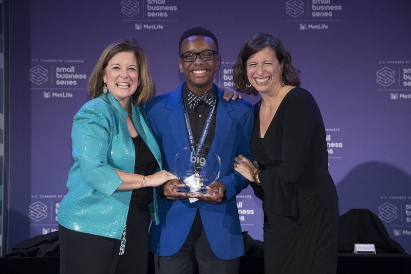Beau Shell (center) accepts the U.S. Chamber of Commerce 2018 Young Entrepreneur Achievement Award at a ceremony held Oct. 3 in Washington, D.C. Shell, 14, is the owner of Athens ice cream vending company Lil’ Ice Cream Dude. Also pictured are Suzanne Clark (left), U.S. Chamber of Commerce senior executive vice president, and Jessica Moser, a senior vice president with MetLife. CONTRIBUTED BY IAN WAGREICH / U.S. CHAMBER OF COMMERCE