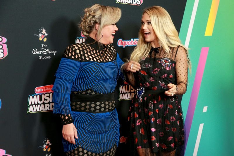 HOLLYWOOD, CA - JUNE 22:  Kelly Clarkson and Carrie Undewood attend the 2018 Radio Disney Music Awards at Loews Hollywood Hotel on June 22, 2018 in Hollywood, California.  (Photo by Rich Fury/Getty Images)