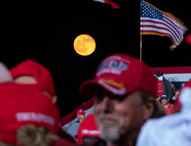 The moon rises behind supporters before the beginning of a Trump rally at Richard B. Russell Airport in Rome on Sunday evening, Nov. 1, 2020. (Photo: Ben Gray for The Atlanta Journal-Constitution)