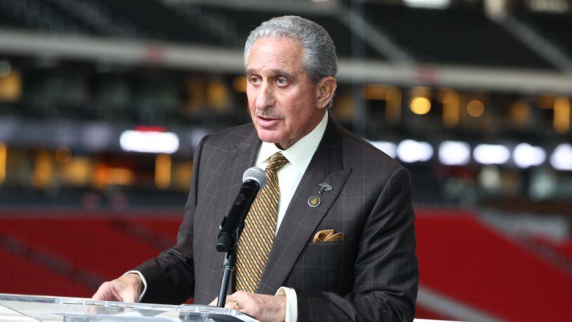 Arthur Blank is presented with a plaque for Mercedes-Benz Stadium’s LEED Platinum certification.