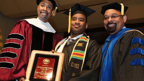 From left to right: Bill Taggart, then Morehouse's interim president, Gerard Vanloo, the college's salutatorian for 2017, and Michael Hodge. PHOTO CREDIT: MOREHOUSE COLLEGE.