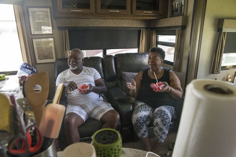 Florida residents Helena and Milton Coleman, who live near Orlando, enjoy a snack inside their camper at the campgrounds inside the Atlanta Motor Speedway in Hampton, Tuesday, Sept. 3, 2019. The couple was visiting Georgia when Hurricane Dorian was predicted to make landfall. ALYSSA POINTER / ALYSSA.POINTER@AJC.COM