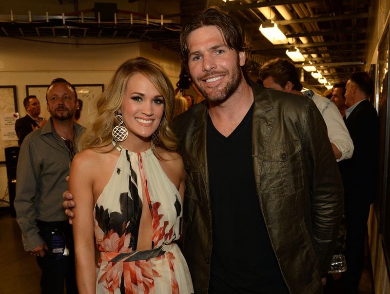  NASHVILLE, TN - JUNE 04: Carrie Underwood and Mike Fisher attend the 2014 CMT Music Awards at Bridgestone Arena on June 4, 2014 in Nashville, Tennessee. (Photo by Rick Diamond/Getty Images for CMT)