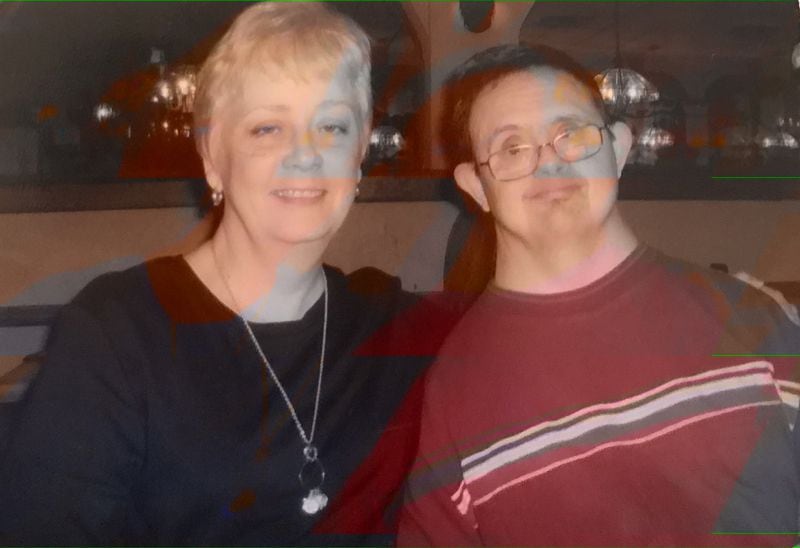 Jones promised her aunt that she would care for her cousin Benton, who has Down syndrome. He moved in with her and was always by her side starting in 2004 (above in 2008). 