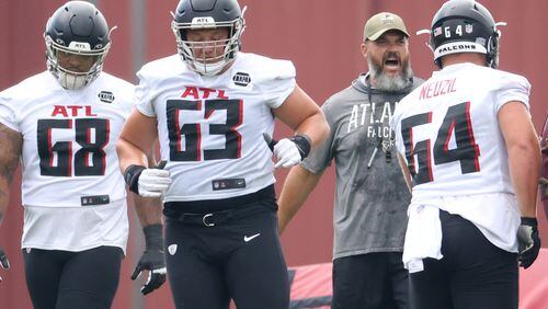 Falcons offensive linemen Elijah Wilkinson (68), Chris Lindstrom (63) and Ryan Neuzil are shown during minicamp. Many spots on the offensive line are up for grabs heading into training camp. (Jason Getz / Jason.Getz@ajc.com)