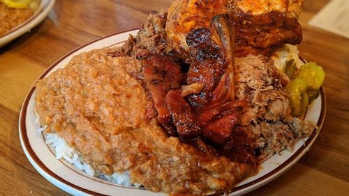 The Plantation Platter at Sconyers Bar-B-Que includes a choice of a quarter-chicken or sliced turkey along with two ribs, chopped beef and chipped pork as well as hash, pickles and a side of coleslaw or potato salad. CONTRIBUTED BY PAULA PONTES