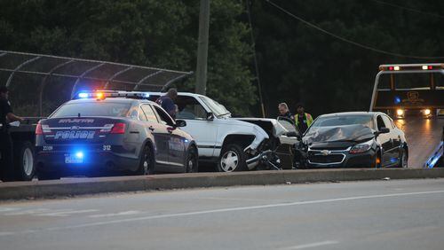 A police chase came to a violent end Friday evening when an allegedly stolen SUV crashed head-on into two vehicles, injuring a total of four people.