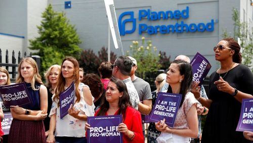 In this file photo, Anti-abortion advocates gather outside the Planned Parenthood clinic in St. Louis.