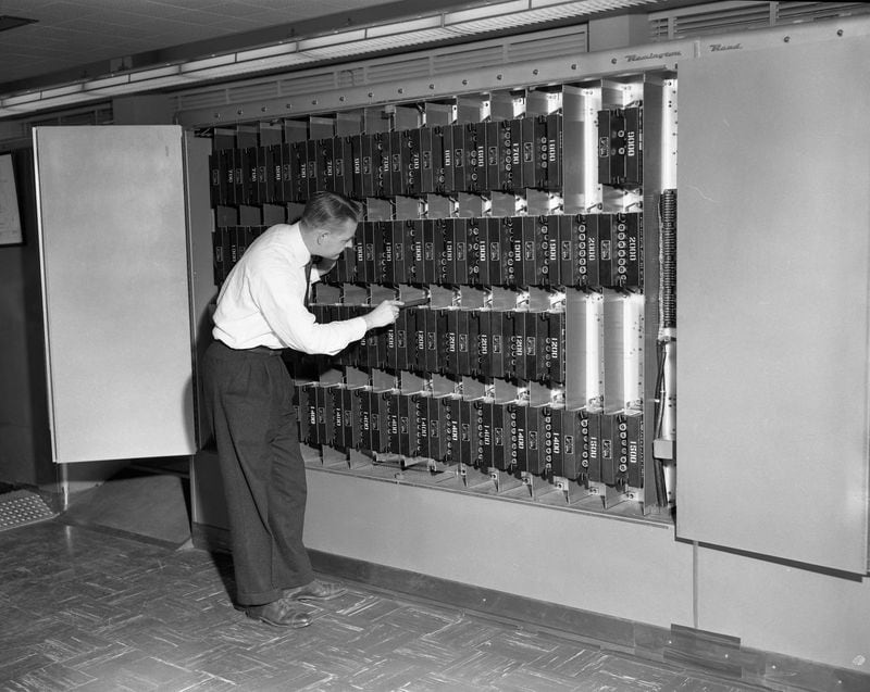 Electronics engineer Charles P. Reed Jr. replaces a chassis in the storage section of the ERA 1101 at Georgia Tech on Oct. 24 1955.