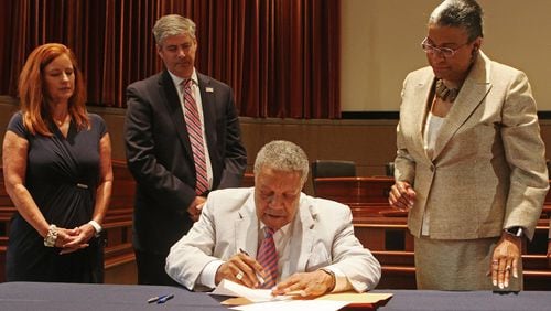 Fulton County commissioners (from left) Liz Hausmann, Bob Ellis and Robb Pitts, chairman of the Fulton County commission, voted to end the county’s administration of federal grants that provide for rehabilitation and infrastructure in poorer areas of the county. AJC FILE PHOTO