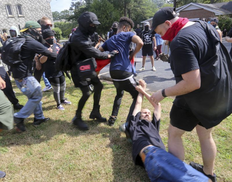 Groups clashed last year during a rally in the city of Stone Mountain. 
(Photo: Jenni Girtman for The Atlanta Journal-Constitution)