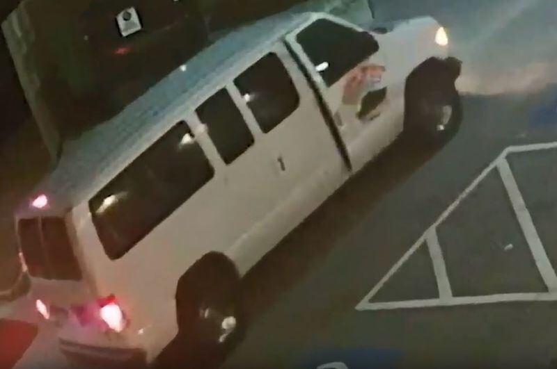 Police described the suspect's van as a 2000s model Ford Econoline-style white passenger van with a distinct logo on the front passenger-side door. (Photo: Atlanta Police Department)