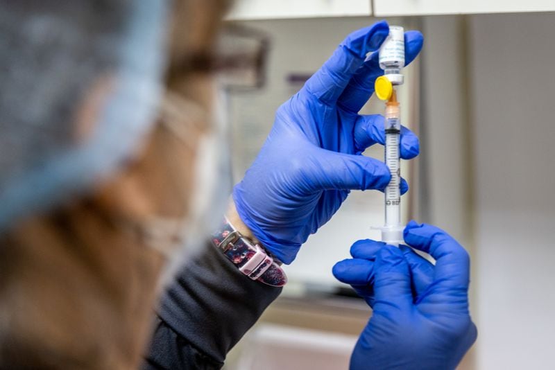 Elizabeth Vogel MN MPH fills syringes with the Monkeypox vaccination Friday morning at the N. DeKalb Health Center in Chamblee, August 5, 2022. Steve Schaefer / steve.schaefer@ajc.com)