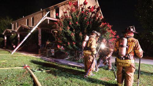 No injuries were reported Wednesday in a predawn fire that heavily damaged a vacant town home just south of downtown Atlanta. JOHN SPINK/JSPINK@AJC.COM