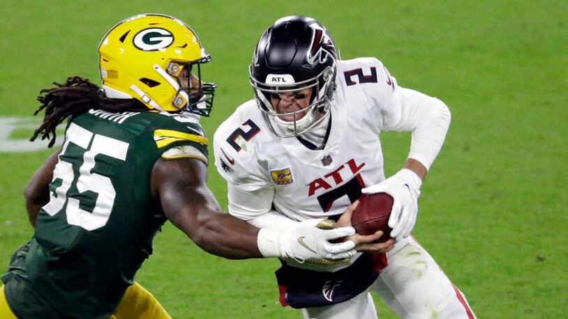 Falcons quarterback Matt Ryan (2) is sacked by Za'Darius Smith of the Packers, Monday, Oct. 5, 2020, in Green Bay, Wis. (AP Photo/Mike Roemer)
