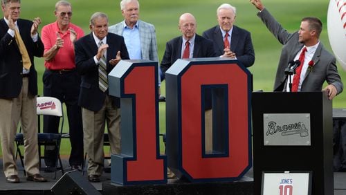 Former Atlanta Brave Dale Murphy, Paul Snyder, former amateur scouting director for the Atlanta Braves , Bobby Cox, former Braves manager, Ted Turner, former Braves owner, Pete Van Wieren, former Braves announcer, and Bill Bartholomay, Braves chairman emeritus, stand and clap as Chipper Jones waves to the crowd during the ceremony to retire his number 10 at Turner Field on Friday, June 28, 2013. JOHNNY CRAWFORD / JCRAWFORD@AJC.COM