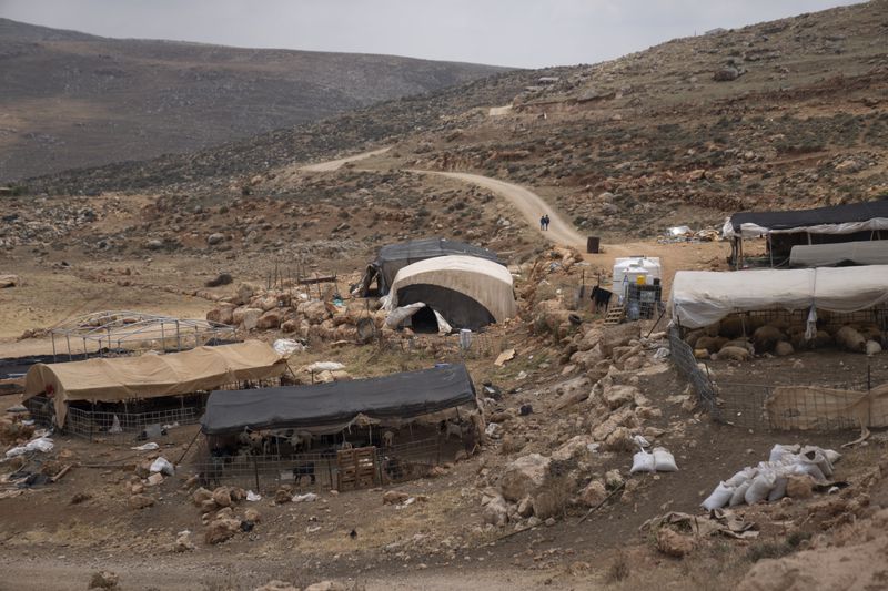 Bedouins fled their homes on the far hillside seen in the background following a wave of attacks by Israeli settlers, Tuesday, April 30, 2024. (AP Photo/Nasser Nasser)