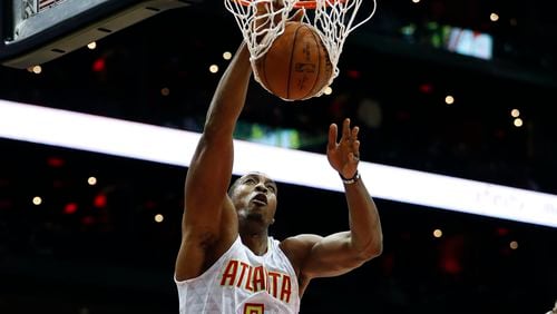 Atlanta Hawks center Dwight Howard (8) scores in the first half of an NBA basketball game against the Miami Heat Wednesday, Dec. 7, 2016, in Atlanta. (AP Photo/John Bazemore)