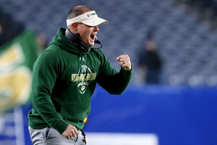 Dec. 30, 2020 - Atlanta, Ga: Grayson coach Adam Carter reacts to their first touchdown in the first half against Collins Hill during the Class 7A state high school football final at Center Parc Stadium Wednesday, December 30, 2020 in Atlanta. JASON GETZ FOR THE ATLANTA JOURNAL-CONSTITUTION