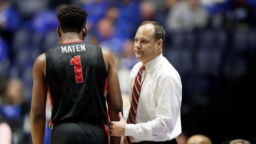 Georgia forward Yante Maten (1) walks to the bench past head coach Mark Fox late in the second half of an NCAA college basketball game between Georgia and Kentucky at the Southeastern Conference tournament Friday, March 10, 2017, in Nashville, Tenn. Kentucky won 71-60. (AP Photo/Wade Payne)