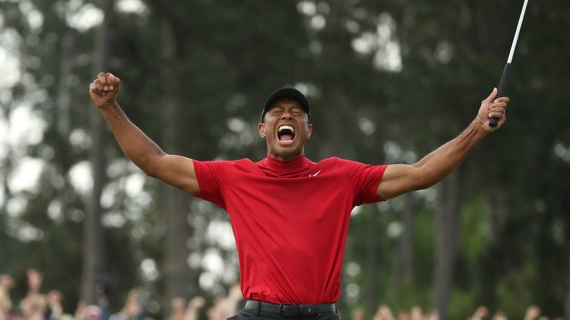 Tiger Woods celebrates winning the Masters during the final round Sunday, April 14, 2019, at Augusta National Golf Club in Augusta. (JASON GETZ/SPECIAL TO THE AJC)