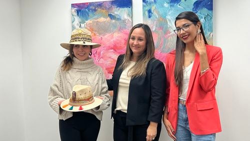 Graduates from the Latin American Association's Latina entrepreneurship program, Avanzando Juntas, show off some of the merchandise they will be selling at a Christmas market on Dec. 4. The market will feature more than 60 Latina vendors.