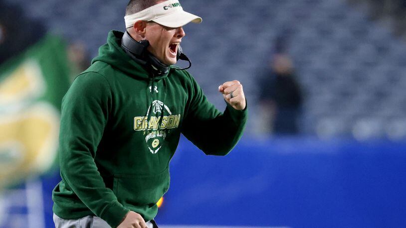 Dec. 30, 2020 - Atlanta, Ga: Former Grayson coach Adam Carter reacts to their first touchdown in the first half against Collins Hill during the Class 7A state high school football final at Center Parc Stadium Wednesday, December 30, 2020 in Atlanta. JASON GETZ FOR THE ATLANTA JOURNAL-CONSTITUTION