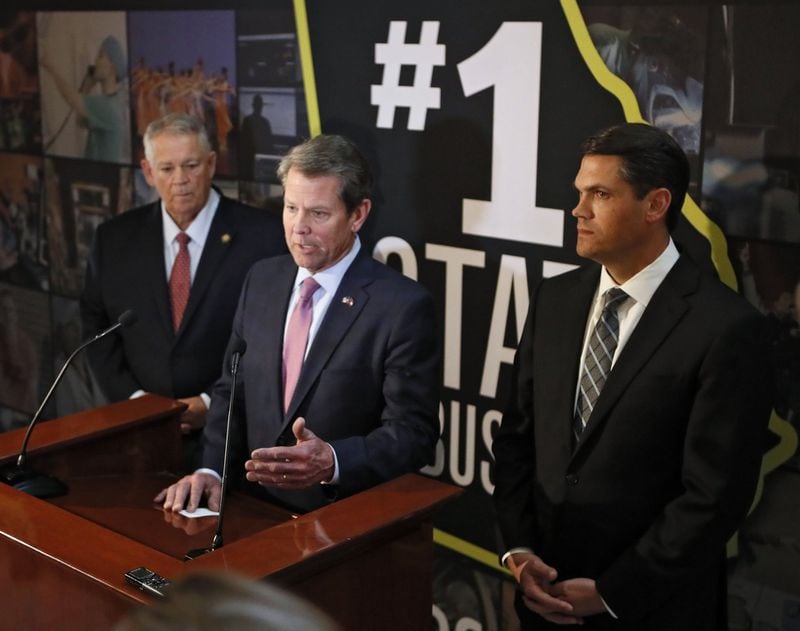 Gov. Brian Kemp, center, is flanked by Lt. Gov. Geoff Duncan, right, and House Speaker David Ralston during a press conference. Bob Andres / bandres@ajc.com