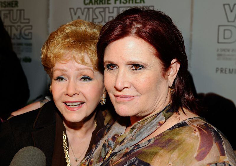 Actress Debbie Reynolds died a day after losing her daughter Carrie Fisher in December 2016. They’re shown together at a 2010 premiere in Hollywood, Calif. KEVORK DJANSEZIAN / GETTY IMAGES 2010