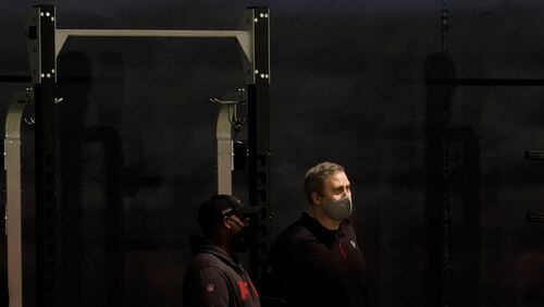 Atlanta Falcons coach Arthur Smith (right) watches the players from Georgia Tech during the school's Pro Day workout Tuesday, March 16, 2021, in Atlanta. (Brynn Anderson/AP)